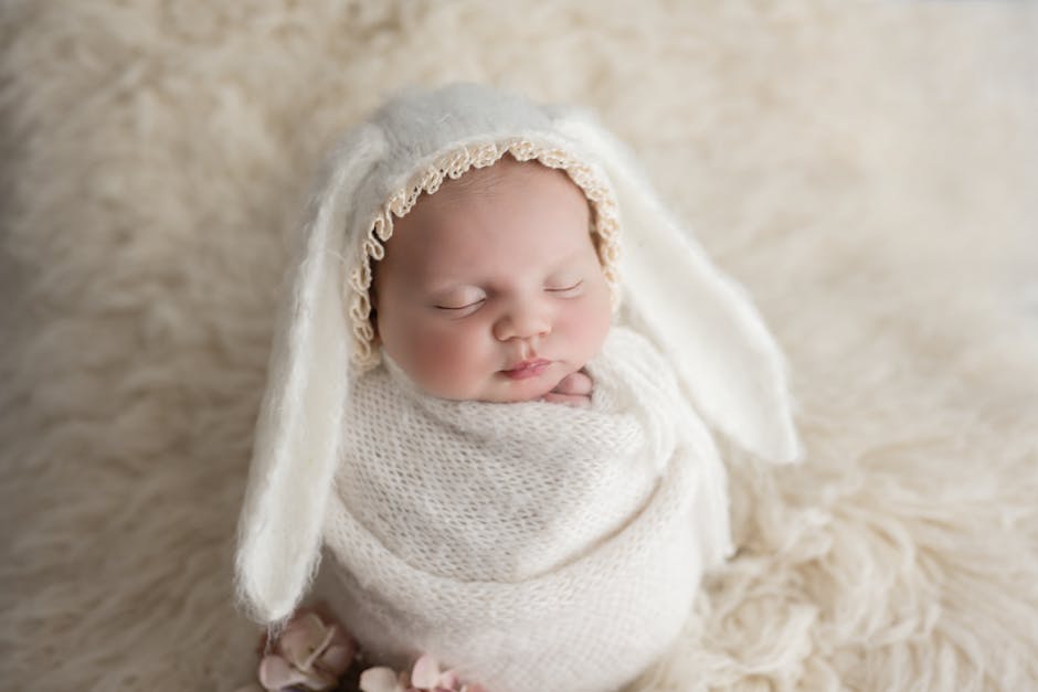 a baby wrapped up in a blanket.
