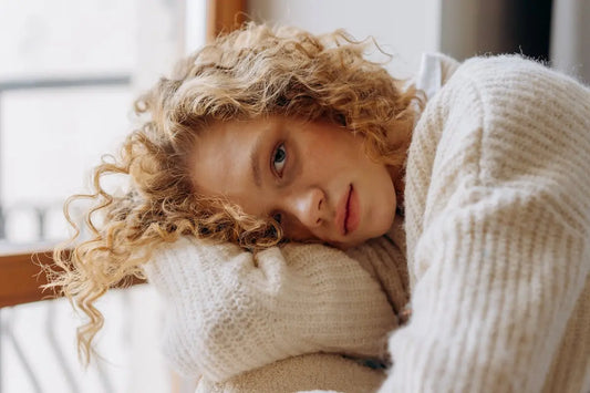 a beautiful woman wearing a cozy sweater